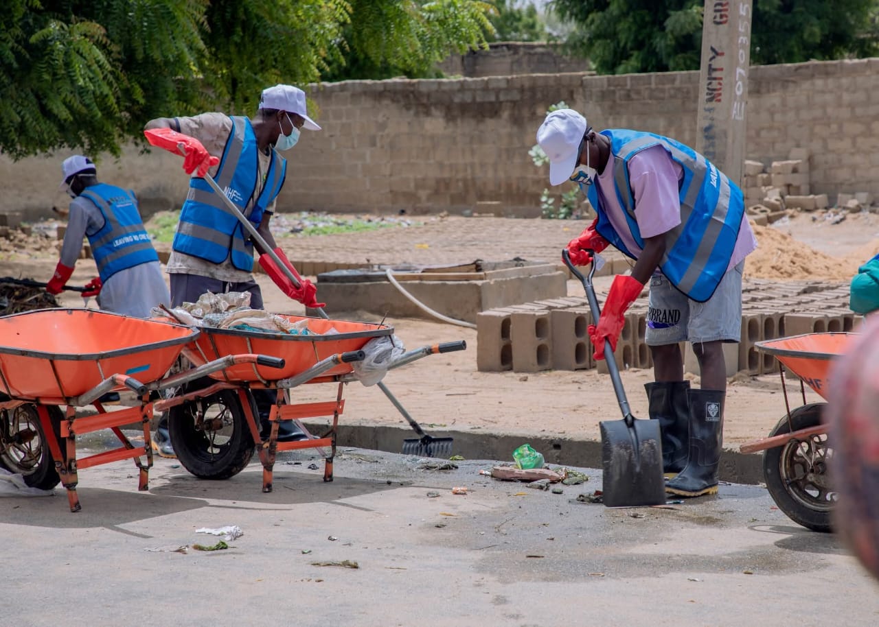 Volunteers clearing waste during a sanitation drive